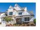 Two-story farmhouse style home with stone accents at 2008 Stratford Ave, Charlotte, NC 28205