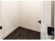 Walk-in closet with dark wood flooring and white walls at 2008 Stratford Ave, Charlotte, NC 28205