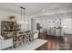 Open concept dining room with a view of the kitchen and features a farmhouse-style table at 2008 Stratford Ave, Charlotte, NC 28205