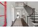 Grand entryway with a dramatic staircase and elegant light fixture at 2008 Stratford Ave, Charlotte, NC 28205