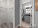 Gray bathroom with vanity and access to a walk-in closet at 2008 Stratford Ave, Charlotte, NC 28205