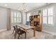 Bright home office with built-in shelving and plenty of natural light at 2008 Stratford Ave, Charlotte, NC 28205