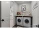 Bright laundry room with side-by-side washer and dryer at 2008 Stratford Ave, Charlotte, NC 28205