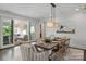 Elegant dining room with a large table, access to the backyard, and stylish light fixture at 2008 Stratford Ave, Charlotte, NC 28205