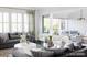 Bright living room showcasing a cozy seating area and access to a sunroom at 2008 Stratford Ave, Charlotte, NC 28205