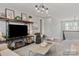 Relaxing living room with comfortable seating and a large TV at 2008 Stratford Ave, Charlotte, NC 28205