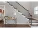 Elegant staircase with dark wood and iron railing at 2008 Stratford Ave, Charlotte, NC 28205