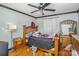 Well-lit bedroom with ceiling fan, hardwood floors and ample closet space at 210 Pinkney Rd, Dallas, NC 28034