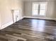 Living room featuring hardwood floors and fireplace at 1012 4Th St, Statesville, NC 28677