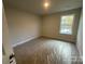 Well-lit bedroom with carpet flooring and a window at 4073 Port Richmond Ave # 17, Gastonia, NC 28056