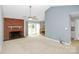 Living room with fireplace and vaulted ceiling at 9408 Vicksburg Park Ct, Charlotte, NC 28210