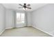 Bright bedroom with ceiling fan and window offering natural light at 9408 Vicksburg Park Ct, Charlotte, NC 28210