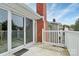 Brick balcony with sliding glass doors and railing at 9408 Vicksburg Park Ct, Charlotte, NC 28210