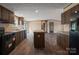 Modern kitchen with island and stainless steel appliances at 1128 Bethesda Rd, Statesville, NC 28677