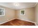 Bright bedroom with hardwood floors and neutral walls at 2023 Garland Ave, Gastonia, NC 28052