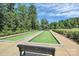 Two bocce ball courts with a shaded bench at 14008 Little Spring Ct # 391, Charlotte, NC 28278