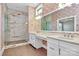Elegant bathroom with double vanity, large shower, and stylish wallpaper at 14008 Little Spring Ct # 391, Charlotte, NC 28278