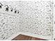 Charming coat closet with dog-themed wallpaper and hooks at 14008 Little Spring Ct # 391, Charlotte, NC 28278