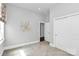 Well-lit bedroom with carpet, double door closet, and neutral walls at 14008 Little Spring Ct # 391, Charlotte, NC 28278