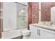 Clean bathroom with tub, shower, and patterned wall at 14008 Little Spring Ct # 391, Charlotte, NC 28278