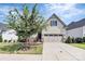 Attractive Craftsman style home with a two-car garage and landscaped front yard at 14008 Little Spring Ct # 391, Charlotte, NC 28278