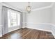 Elegant dining room featuring hardwood floors and a large window at 14008 Little Spring Ct # 391, Charlotte, NC 28278