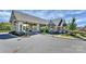 Elegant clubhouse entrance with landscaping at 14008 Little Spring Ct # 391, Charlotte, NC 28278