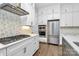 Modern kitchen with stainless steel appliances and white shaker cabinets at 14008 Little Spring Ct # 391, Charlotte, NC 28278