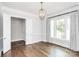 Formal dining room with hardwood floors and neutral wall colors at 14008 Little Spring Ct # 391, Charlotte, NC 28278
