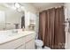 Clean bathroom with shower/tub and brown shower curtain at 1300 Reece Rd # 302, Charlotte, NC 28209