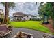 Large backyard featuring a pergola, fire pit, and green lawn at 6421 Chadwell Ct # 61, Fort Mill, SC 29707