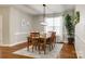 Formal dining room featuring hardwood floors and a modern light fixture at 6421 Chadwell Ct # 61, Fort Mill, SC 29707