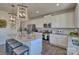 Modern kitchen with granite countertops, white cabinets, and stainless steel appliances at 311 Coronado Ave # 62, Matthews, NC 28104