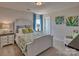 Charming bedroom with white bed frame and green accents at 311 Coronado Ave # 62, Matthews, NC 28104