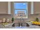Kitchen sink with a view of the backyard from a large window at 311 Coronado Ave # 62, Matthews, NC 28104