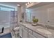 Double vanity bathroom with granite countertop and shower/tub combo at 311 Coronado Ave # 62, Matthews, NC 28104
