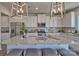 Island kitchen with granite countertops, white cabinets, and stainless steel appliances at 311 Coronado Ave # 62, Matthews, NC 28104