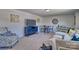 Bright bonus room features a comfortable seating area and a convenient table for two at 311 Coronado Ave # 62, Matthews, NC 28104