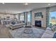 Open living room features a fireplace and kitchen views at 311 Coronado Ave # 62, Matthews, NC 28104