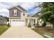 Two-story house with a large driveway and attractive landscaping at 14217 Ridgewater Way, Charlotte, NC 28278