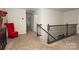 Upstairs hallway with plush carpeting and access to additional bedrooms at 14217 Ridgewater Way, Charlotte, NC 28278