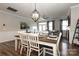 Farmhouse style dining room with a wood table and white chairs at 14217 Ridgewater Way, Charlotte, NC 28278