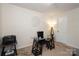 Home office with glass desk and comfortable chair at 14217 Ridgewater Way, Charlotte, NC 28278