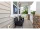 Cozy front porch with wicker chairs at 14217 Ridgewater Way, Charlotte, NC 28278