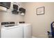 Laundry room with washer, dryer, and ample shelving at 14217 Ridgewater Way, Charlotte, NC 28278
