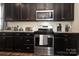 Well-equipped kitchen boasts dark cabinets and stainless steel appliances at 14217 Ridgewater Way, Charlotte, NC 28278