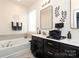 Modern bathroom with double vanity, soaking tub and separate shower at 14217 Ridgewater Way, Charlotte, NC 28278