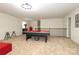 Spacious bonus room with pool table and seating area at 14217 Ridgewater Way, Charlotte, NC 28278