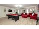 Bonus room with pool table, sectional sofa, and plenty of space for entertainment at 14217 Ridgewater Way, Charlotte, NC 28278