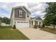 Two-story home with a large driveway at 14217 Ridgewater Way, Charlotte, NC 28278